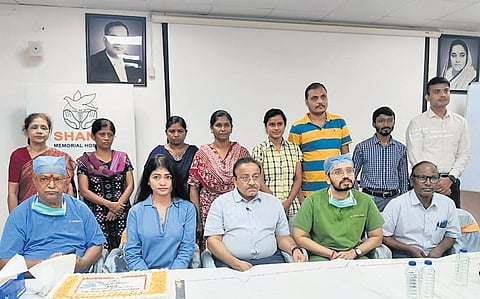 Doctors and staff celebrating the successful completion of the hospital’s 100th robotic surgeries, on Monday.