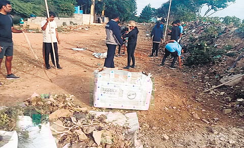 Residents and activists clean the bed of Yele Mallappa Shetty Lake recently