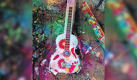 A guitar-shaped cracker that exploded while people held it.