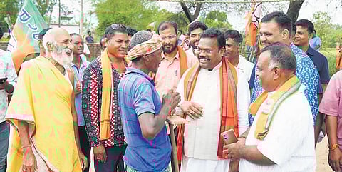 BJP leaders interacting with voters in Komna block of Nuapada on Monday.