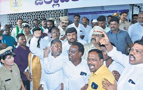 Leaders of Dalit organisations shout slogans against RSS after a peace committee meeting in Kalaburagi on Tuesday