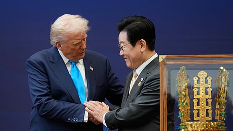 US President Donald Trump shakes hands with South Korean President Lee Jae Myung as they attend a high honor ceremony at the Gyeongju National Museum in Gyeongju, South Korea, Wednesday, Oct. 29, 2025.