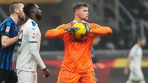 Inter Milan's goalkeeper Josep Martinez, right, in action during an Italian Cup quarter final soccer match between Inter Milan and Lazio at the San Siro stadium in Milan, Italy, Feb. 25, 2025. (AP Photo/Luca Bruno, File)
