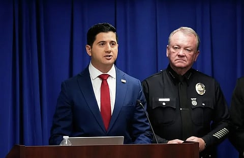 Acting U.S. Attorney Bill Essayli, left, speaks next to Los Angeles Police Chief Jim McDonnell during a news conference announcing an arrest made in the Palisades Fire, Wednesday, Oct. 8, 2025, in Los Angeles.