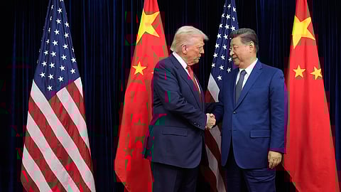 President Donald Trump, left, and Chinese President Xi Jinping shake hands before their meeting at Gimhae International Airport in Busan, South Korea, Thursday, Oct. 30, 2025.
