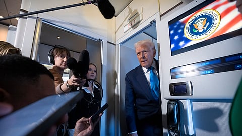 US President Donald Trump speaks to reporters aboard Air Force One as he travels from Tokyo, Japan, to South Korea, Wednesday, Oct. 29, 2025.