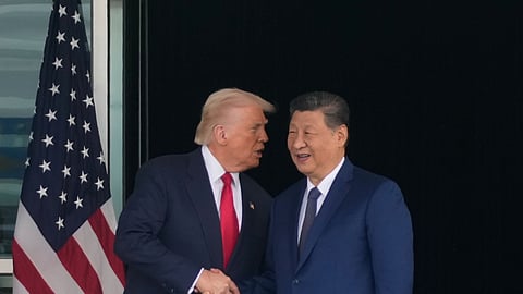 US President Donald Trump, left, and Chinese President Xi Jinping shake hands after their summit talk at Gimhae International Airport in Busan, South Korea, Thursday, Oct. 30, 2025.