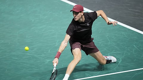 Italy's Jannik Sinner returns the ball to Belgium's Zizou Bergs during their second round match at the Paris Masters tennis tournament at the Paris La Defense Arena, Wednesday, Oct. 29, 2025, in Paris.