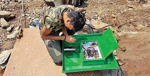 17-year-old Hridank Bhagath works on his AI-powered BirdRover.