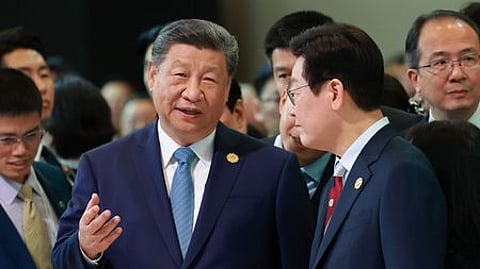 South Korean President Lee Jae Myung (R) and China's President Xi Jinping attending the gala dinner during the Asia-Pacific Economic Cooperation (APEC) Summit in Gyeongju.