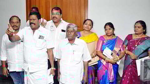 AIADMK councillors walking out of the Salem City Municipal Corporation council meeting on Friday.