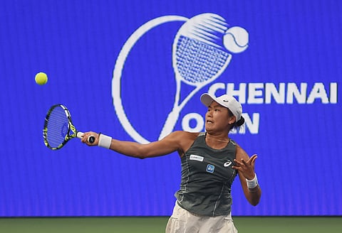 Janice Tjen of Indonesia hits a return against Slovakia's Mia Pohankova on Friday