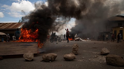 People protest in the streets of Arusha, Tanzania, on election day Wednesday.