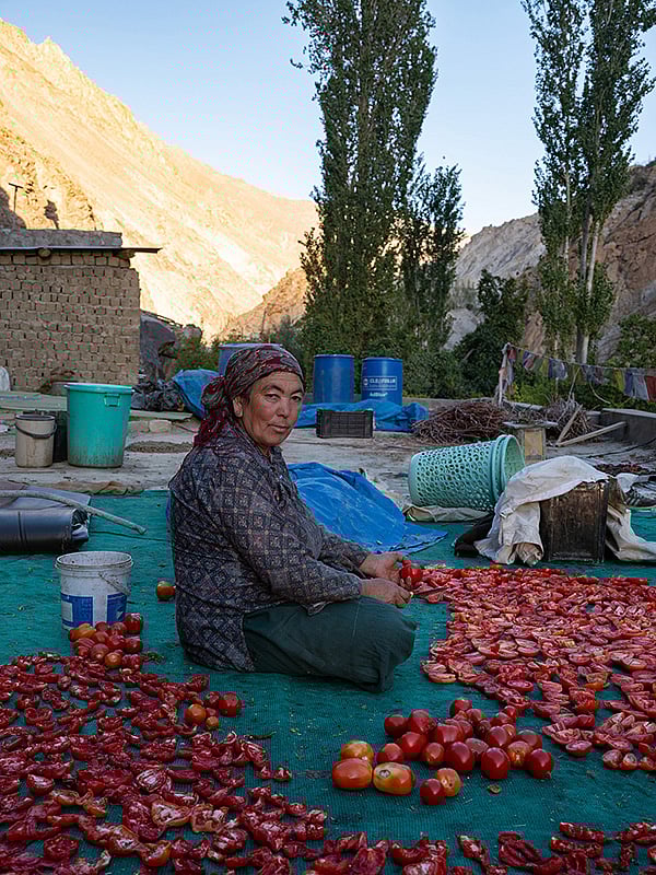 A photo of Tsewang Dolma slicing tomatoes