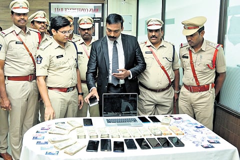 EAGLE chief Ake Ravi Krishna and Eluru district SP K Pratap Siva Kishore explaining the modus operandi of the racket on Saturday