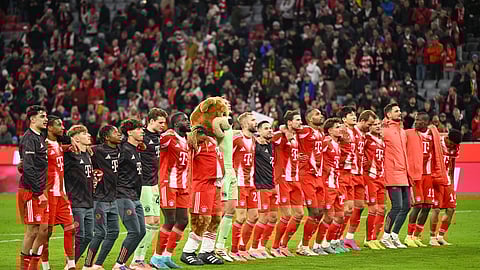 Bayern Munich players celebrate their victory after the Bundesliga soccer match between Bayern Munich and Borussia Dortmund in Munich, Germany, Saturday, Oct. 18, 2025.