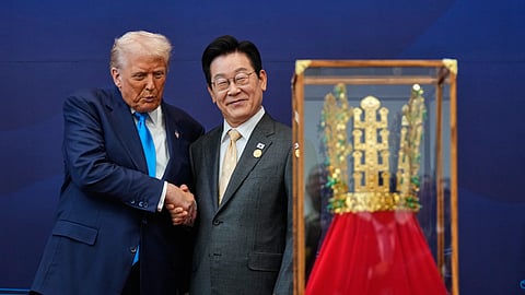 President Donald Trump shakes hands with South Korean President Lee Jae Myung as he receives a gift of a gold crown and an award of the Grand Order of Mugunghwa, not seen, during a high honor ceremony at the Gyeongju National Museum in Gyeongju, South Korea, Wednesday, Oct. 29, 2025.