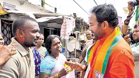 Union Minister G Kishan Reddy conducts a door-to-door campaign at Rahmatnagar, which is part of the Jubilee Hills Assembly constituency, in Hyderabad on Saturday.
