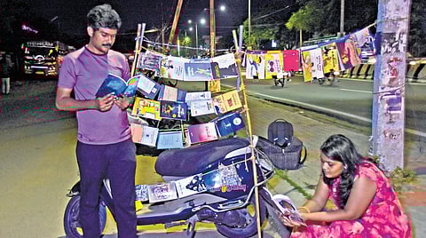 Readers immerse themselves in books at Simon’s bike library in Thoothukudi.