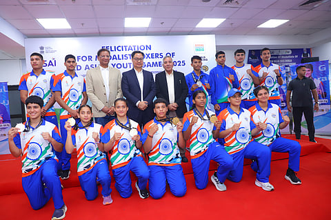 Medal winners with BFI chief Ajay Singh (3rd R; second row) and Minister of Parliamentary Affairs and Minority Affairs Kiren Rijiju