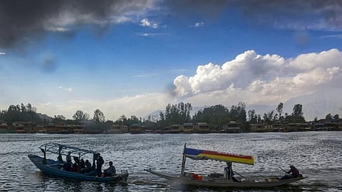 Tourists ride 'Shikara' at the Dal Lake in Srinagar.