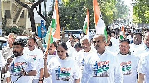 BJP MPs Shobha Karandlaje and PC Mohan take part in a ‘Unity March’ in Bengaluru on Friday.