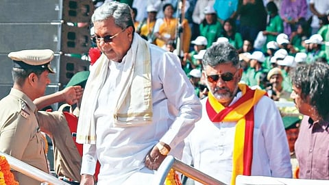CM Siddaramaiah and Deputy CM DK Shivakumar arrive for Kannada Rajyotsava celebrations at Kanteerava Stadium in Bangaluru.