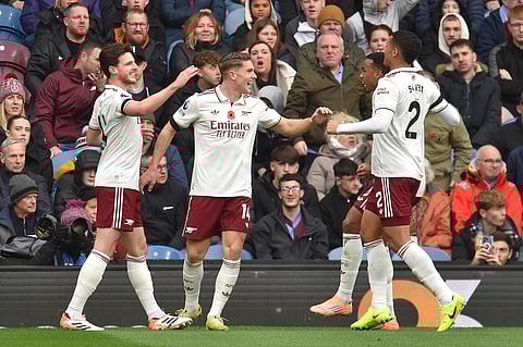 Arsenal's Swedish striker Viktor Gyokeres (C) celebrates with teammates after scoring the opening goal of the EPL football match between Burnley and Arsenal at Turf Moor in Burnley, north-west England on November 1, 2025.