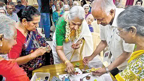 Members of HEY trying their hands at painting diyas.