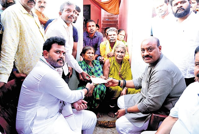 Rammohan Naidu distributed compensation cheques for Rs 15 lakh each to the families of the deceased.