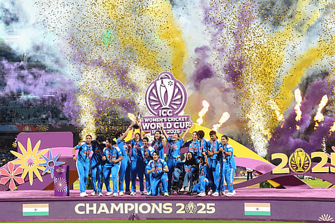 India's players pose with the winning trophy after their win over South Africa in the ICC Women's Cricket World Cup final match in Navi Mumbai, India, Sunday, Nov. 2, 2025.