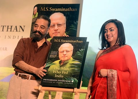 MP Kamal Haasan releasing the book ‘The Man Who Fed India’ with author Priyambada Jayakumar.