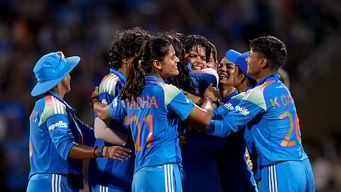 India's players celebrate the wicket of South Africa's Sune Luus during the ICC Women's World Cup final ODI cricket match between India Women and South Africa Women, at the DY Patil Stadium, in Navi Mumbai, Sunday, Nov. 2, 2025.