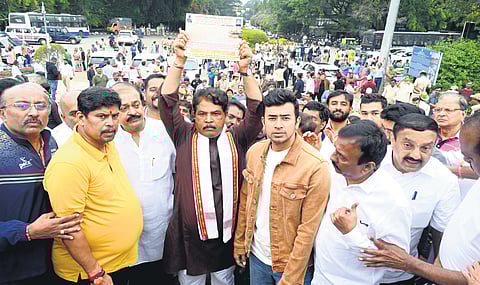 BJP leaders, including Leader of Opposition in the Assembly R Ashoka and Bangalore South Lok Sabha MP Tejasvi Surya, protest against the tunnel road project at Lalbagh on Sunday.