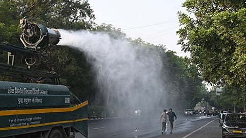 An anti-smog gun sprays water droplets to curb air pollution.