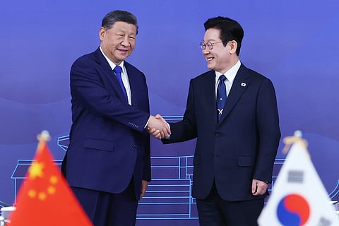 Chinese President Xi Jinping, left, shakes hands with South Korean President Lee Jae Myung before their summit meeting on the sidelines of the the Asia-Pacific Economic Cooperation (APEC) summit, at the Gyeongju National Museum in Gyeongju, South Korea, Saturday, Nov. 1, 2025.