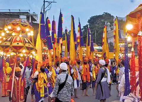 Nishan Sahiban being carried by Nishanchis during Nagar Keertan held as part of the 556th Prakash Purab of Sri Guru Nanak Dev in the Old City.