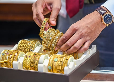 In the domestic market, gold on the Multi Commodity Exchange (MCX) hovered near Rs119,900 per 10 grams,
