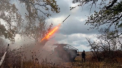 In this image made from video provided by the Russian Defence Ministry Press Service on Friday, Oct. 31, 2025, a Russian "Grad" self-propelled 122 mm multiple rocket launcher fires towards Ukrainian positions at an undisclosed location in Ukraine.