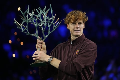 Italy's Jannik Sinner holds the trophy after winning the final match of the Paris Masters tennis tournament against Canada's Felix Auger-Aliassime in Paris, Sunday, Nov. 2, 2025.