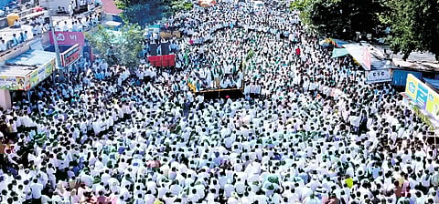 A large gathering of sugarcane farmers stages an indefinite protest in Gurlapur, near Belagavi, on Tuesday.