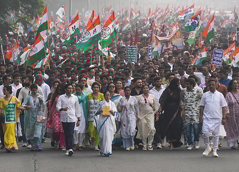 West Bengal CM and TMC supremo Mamata Banerjee with the party's General Secretary and MP Abhishek Banerjee and other party leaders takes part in a protest rally against SIR.
