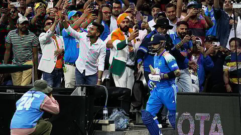 Fans cheer as Virat Kohli walks out to bat at the SCG.