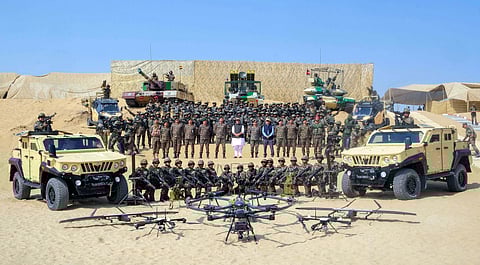 In this photo from Oct 24, 2025, Defence Minister Rajnath Singh reviews a dynamic demonstration by the Bhairav Battalion and Ashni Platoon, showcasing next-gen combat vehicles, tanks, and drone systems at Longewala, in Jaisalmer.