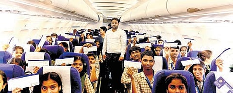 Students showing their flight tickets in a virtual interaction with Investments and Infrastructure Minister BC Janardhan Reddy on Wednesday.