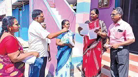 Election officials engaged in collecting voter details for the Special Intensive Revision process in Tiruchy on Wednesday.