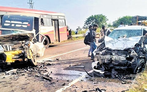 Passerby observes the aftermath of the car collision near Bidar on Wednesday.