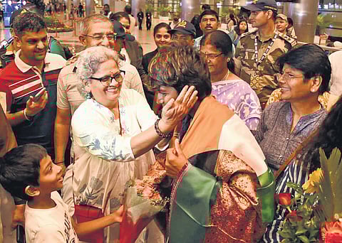 Arundhati Reddy, a member of the the World Cup-winning Indian cricket team, receives a warm welcome by fans on arrival at the Rajiv Gandhi International Airport (RGIA) in Hyderabad on Thursday.