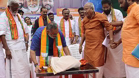 BJP state president Rajeev Chandrasekhar makes a comfort way to veteran leader O Rajagopal during the inaugural function of partys local body electoral interaction march, titled "Vikasitha Ananthapuri".