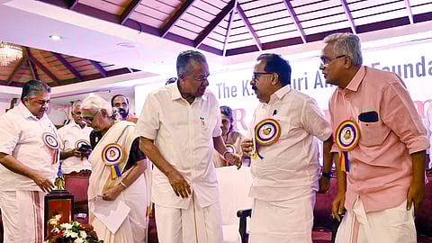 Chief Minister Pinarayi Vijayan engaging in cordial conversation with former Opposition Leader Ramesh Chennithala during the inauguration of the KR Gouri Amma Award ceremony, accompanied by CPI State Secretary Binoy Viswam, award winner Aruna Roy, and Cultural Minister Saji Cheriyan, at Mascot Hotel in Thiruvananthapuram.